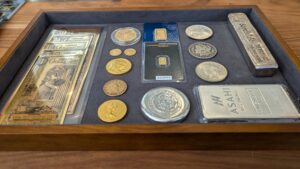 A tray containing various coins