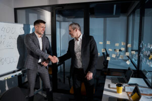 Two business men shaking hands